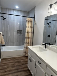 Finished bathroom with tub, shower, and new tile